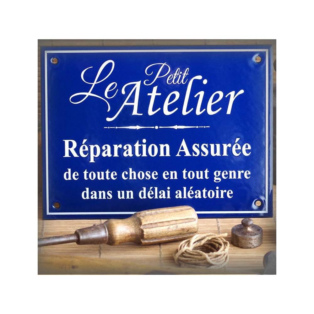 Enamel sign "Le Petit Atelier : réparation assurée"